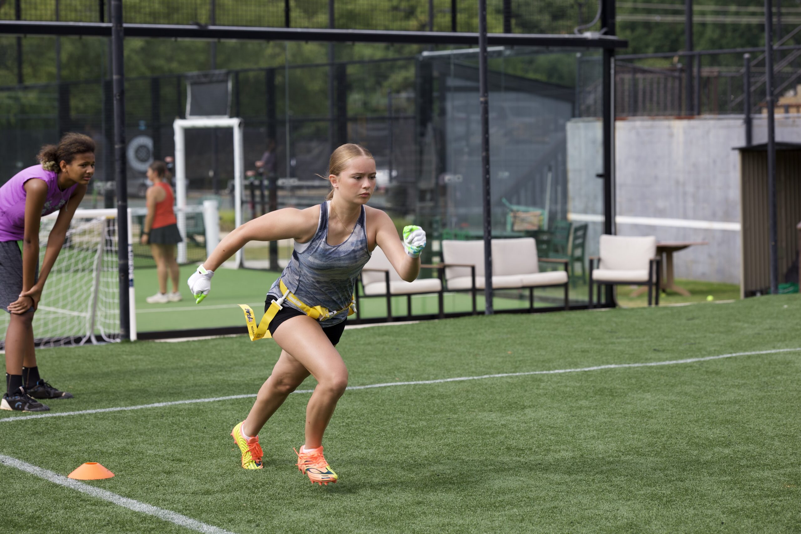 GirlPower Carolinas athlete training with a football