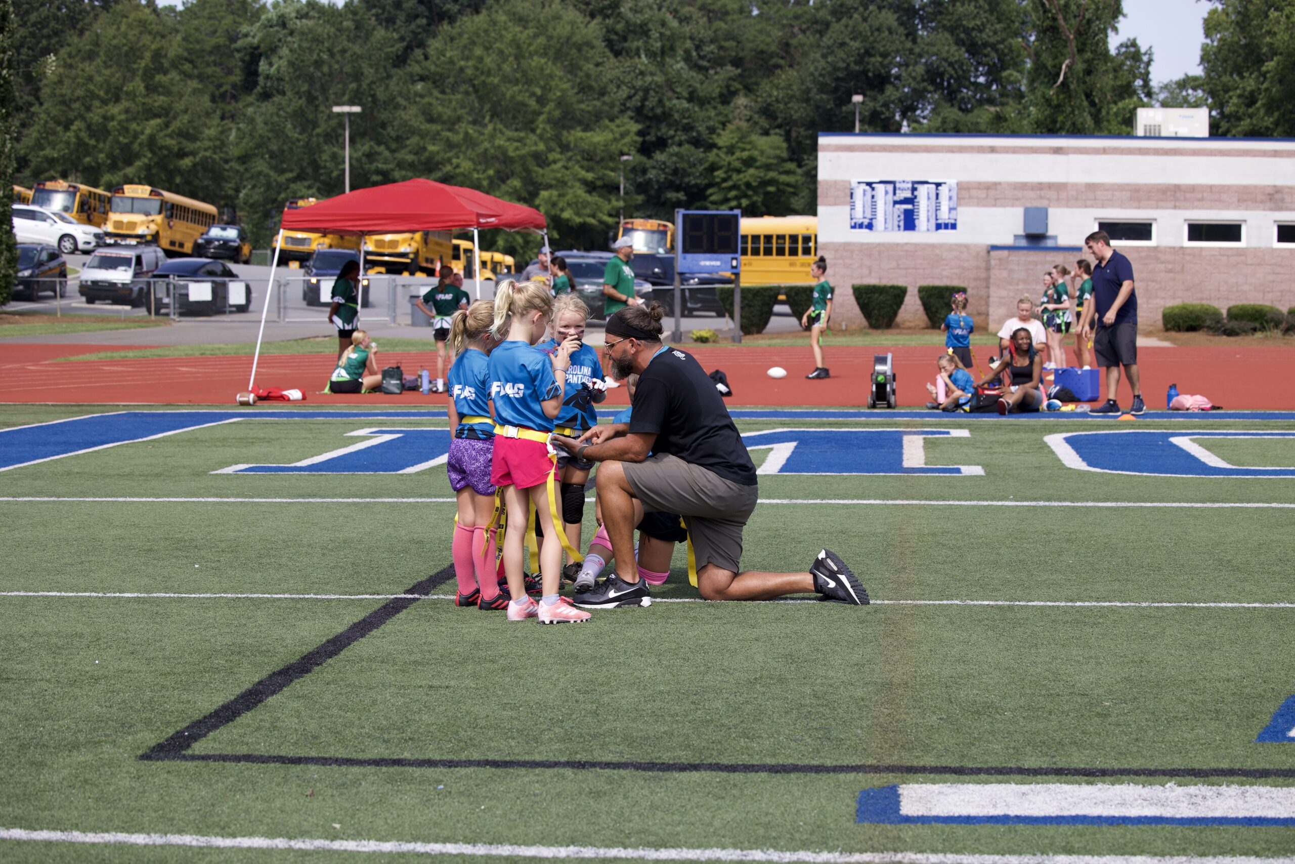 GirlPower Carolinas coach working with girls flag football athletes